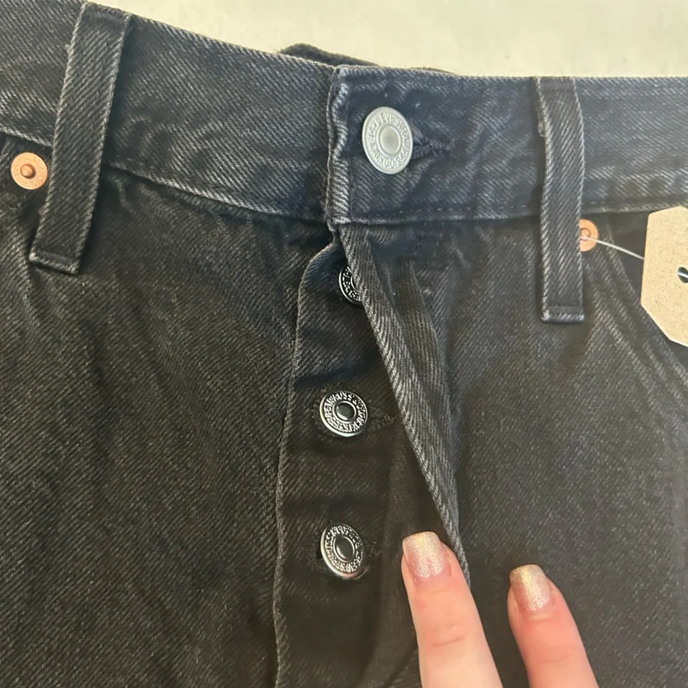 Levi’s NWT black 501 original fit high rise distressed black denim jean shorts